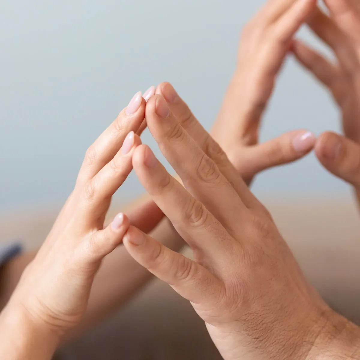 people touching fingertips